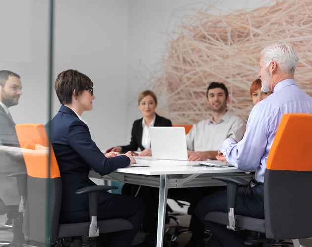 business people group on meeting at modern bright office indoors. Senior  businessman as leader in discussion.-1